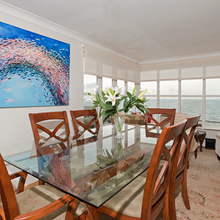 The dining room looks out onto the sea