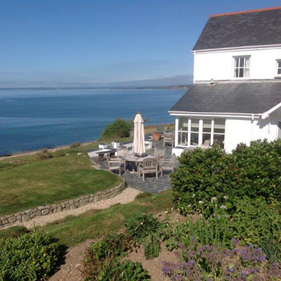 Perched above a three mile shingle beach and overlooking the Atlantic Ocean